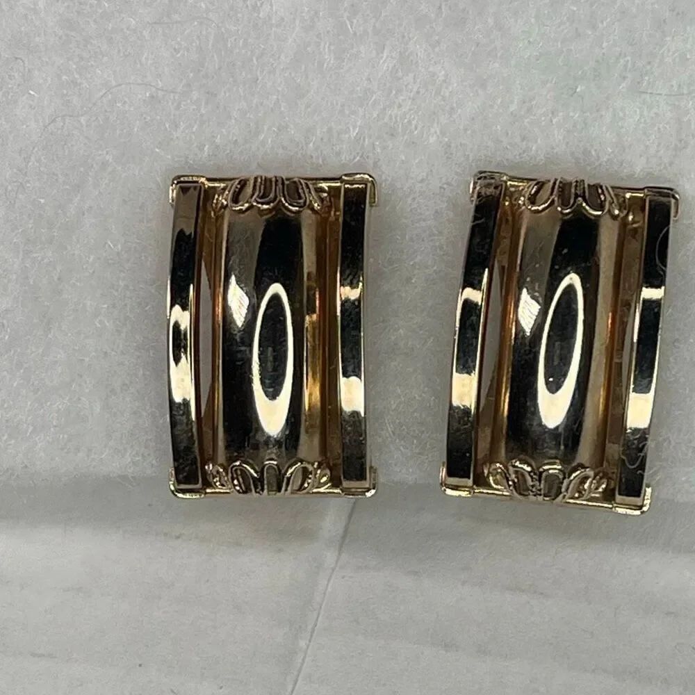 Vintage rectangular slightly curved highly polished clip earrings.
